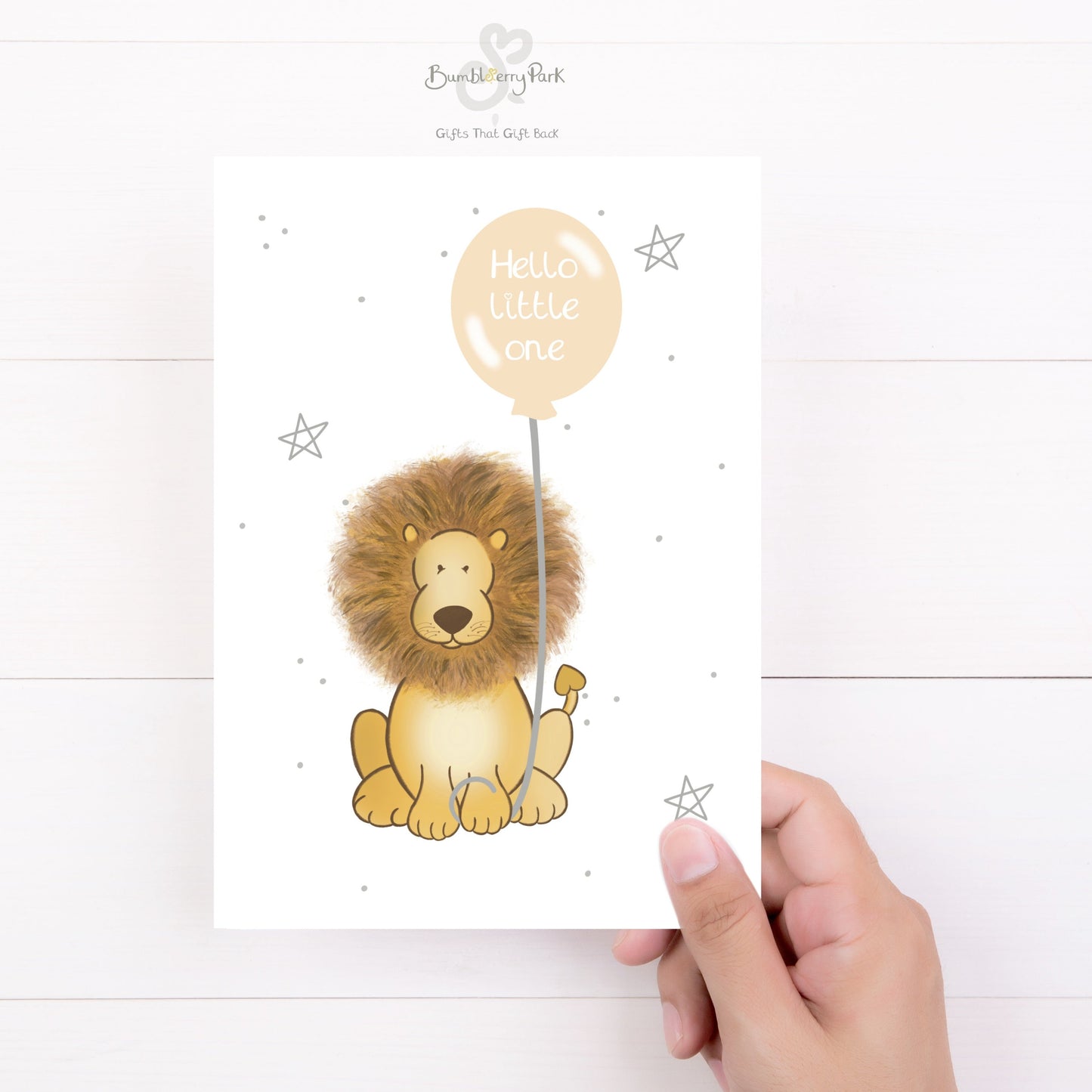 luxury safari new baby card for new baby girl boy as a baby shower gift with a baby lion holding a peach balloon with hello little one in it