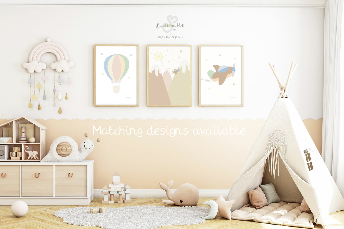 set of three nursery travel prints of hot air balloon, aeroplane and mountains in a children's playroom