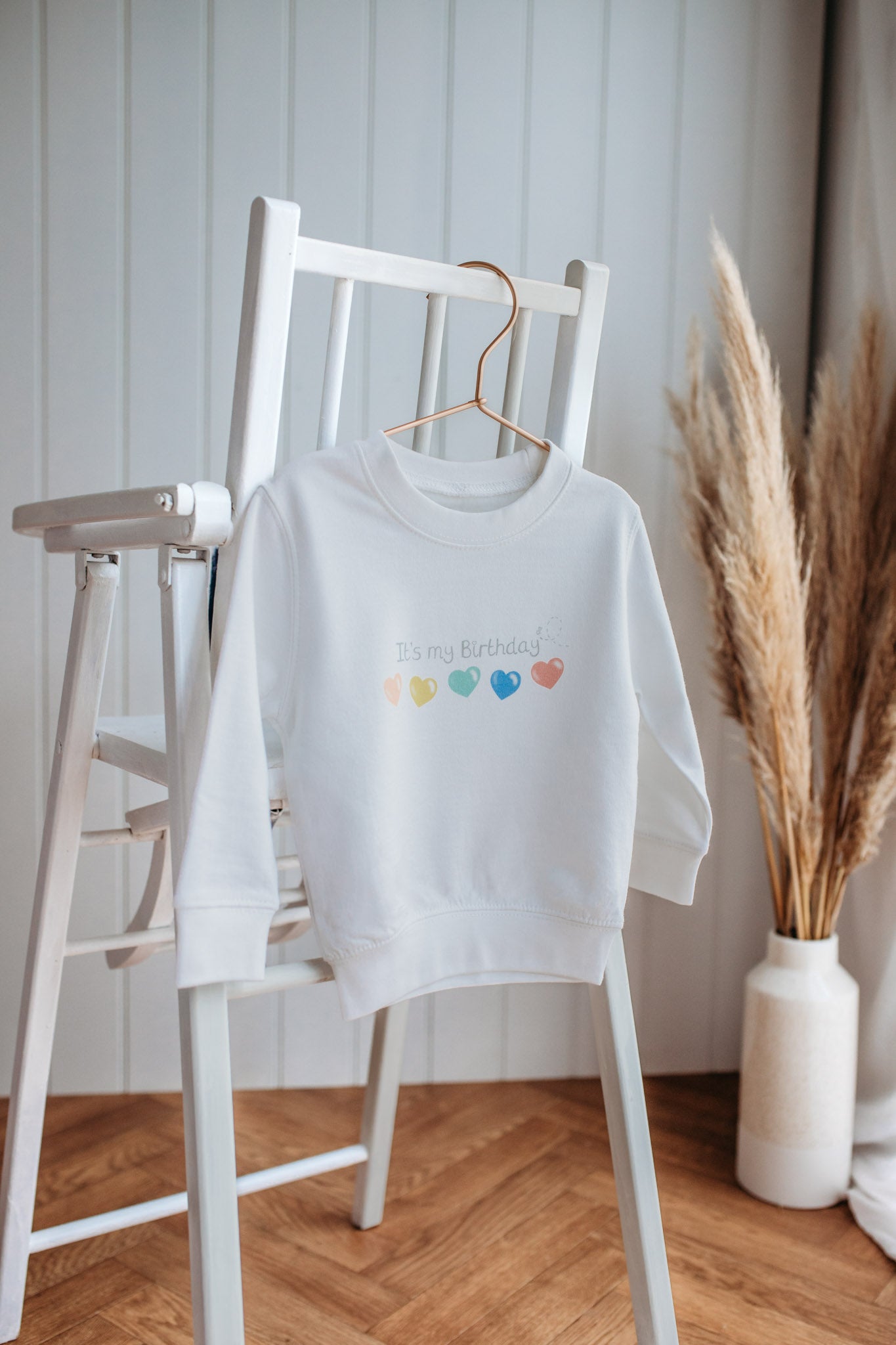 nursery baby high chair with a birthday sweatshirt with a "it's my Birthday" print for boy girl birthday gift