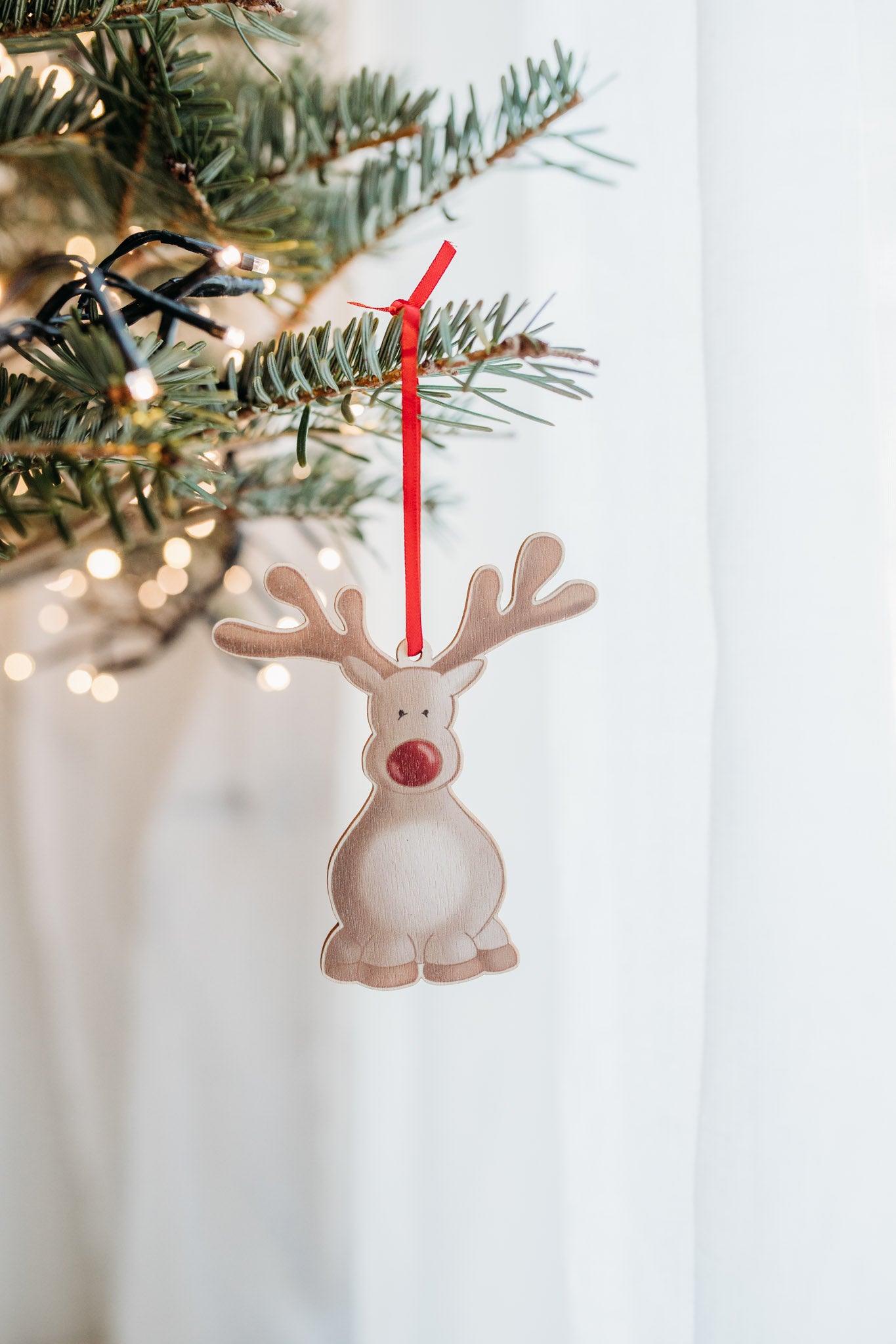 rudolph reindeer wooden hanging decoration on a christmas tree