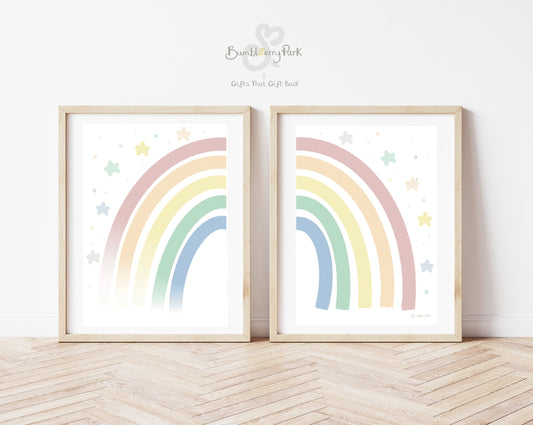 set of 2 rainbow nursery prints in bright pastel colours with stars