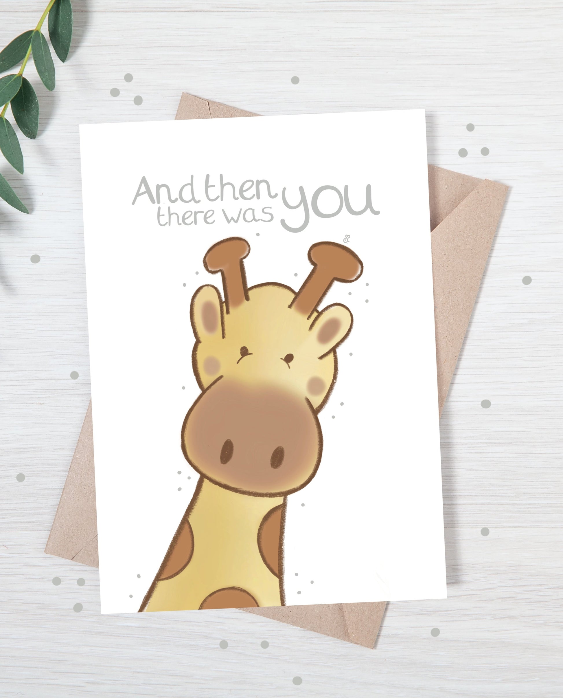 Handmade luxury new baby christening greetings card with a safari theme baby giraffe popping up from the bottom with the title &quote "and then there was you" on a white background, with a kraft envelope