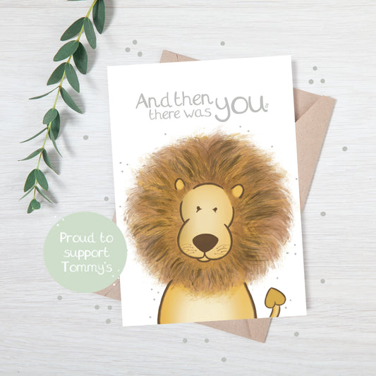 Handmade luxury new baby christening greetings card with a safari theme baby lion popping up from the bottom with the title &quote "and then there was you" on a white background, with a kraft envelope