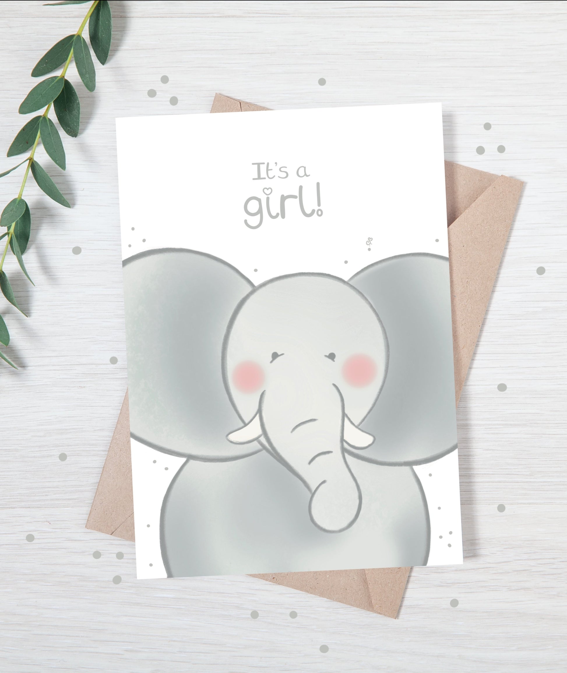 Handmade luxury new baby christening greetings card with a safari theme baby elephant popping up from the bottom with the title &quote "it's a boy" on a white background, with a kraft envelope