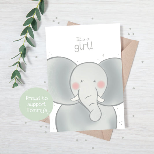 Handmade luxury new baby christening greetings card with a safari theme baby elephant popping up from the bottom with the title &quote "it's a girl" on a white background, with a kraft envelope