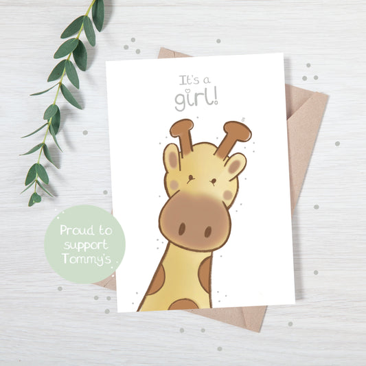 Handmade luxury new baby christening greetings card with a safari theme baby giraffe popping up from the bottom with the title &quote "it's a girl" on a white background, with a kraft envelope