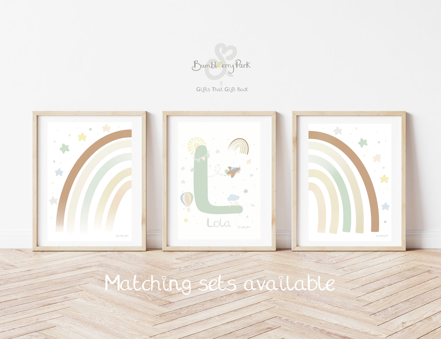 et of three matching rainbow wall prints for children's bedroom. Neutral nursery decor prints with personalised initial letter and name print, with travel and transport theme decor with rainbows, sunshine, hot air balloon and aeroplane features