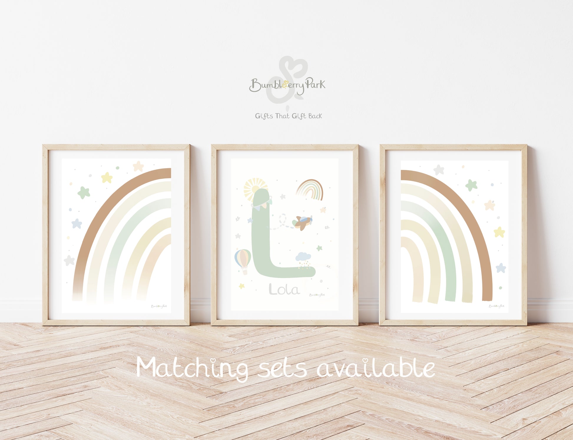 et of three matching rainbow wall prints for children's bedroom. Neutral nursery decor prints with personalised initial letter and name print, with travel and transport theme decor with rainbows, sunshine, hot air balloon and aeroplane features
