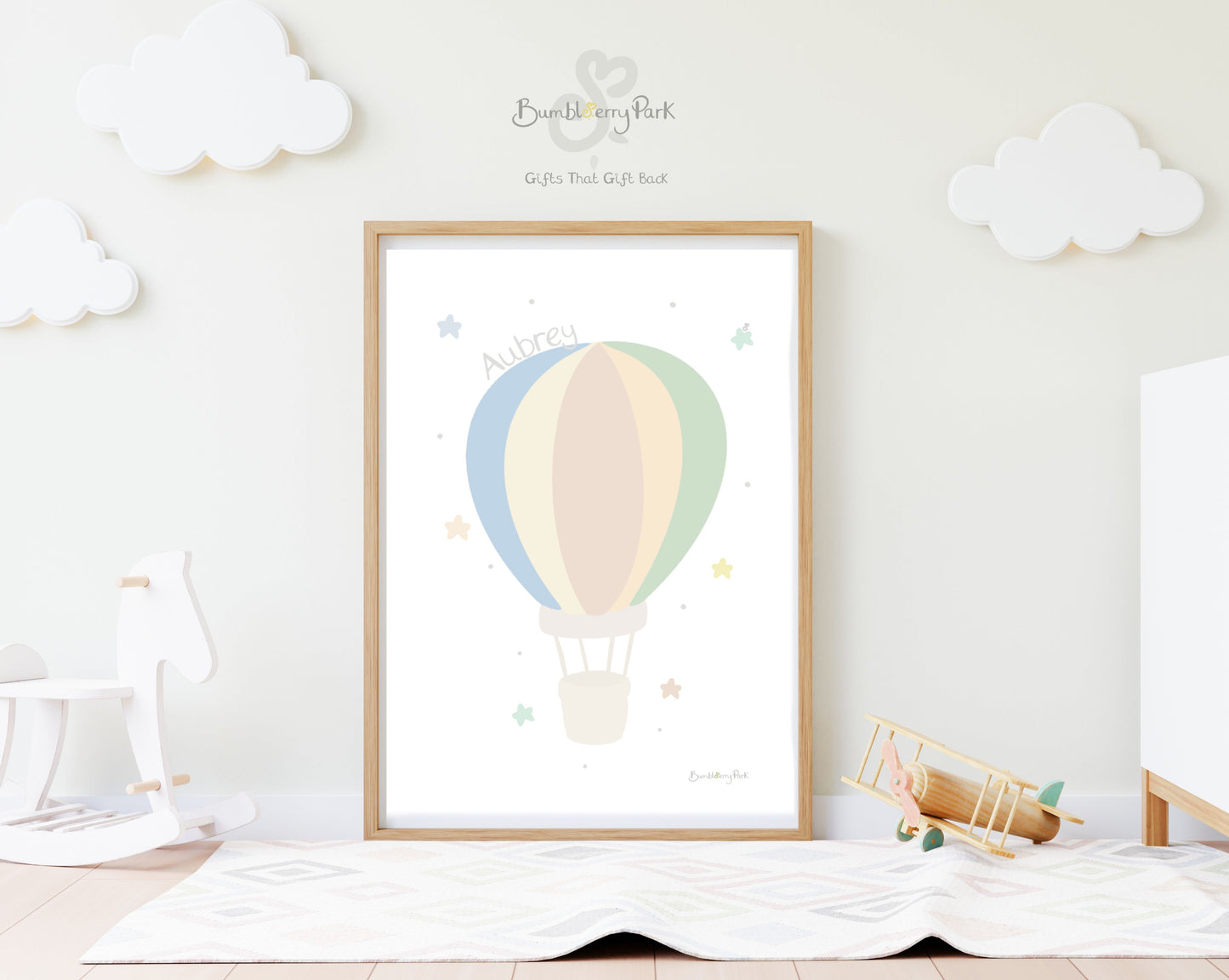 hot air balloon nursery print in neutral colours in a nursery setting