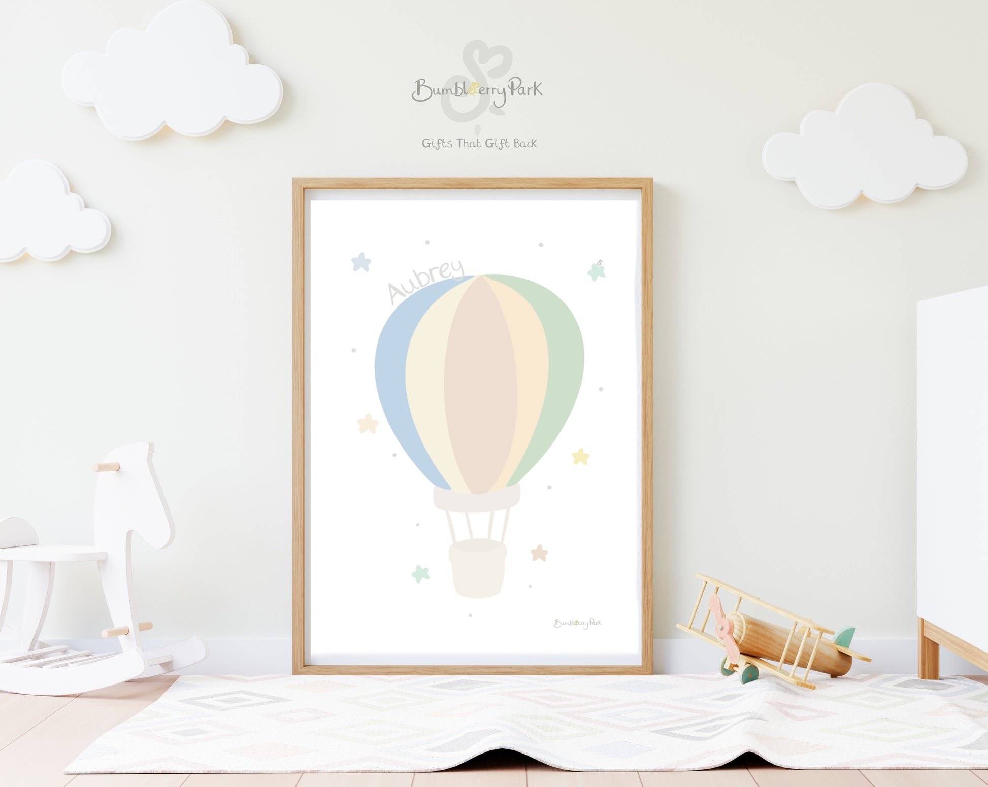 hot air balloon nursery print in neutral colours in a nursery setting