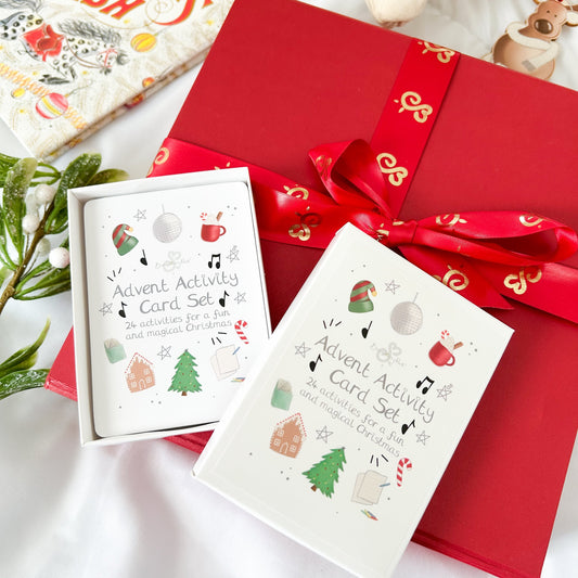 advent activity card set for children on top of a luxury red christmas gift box