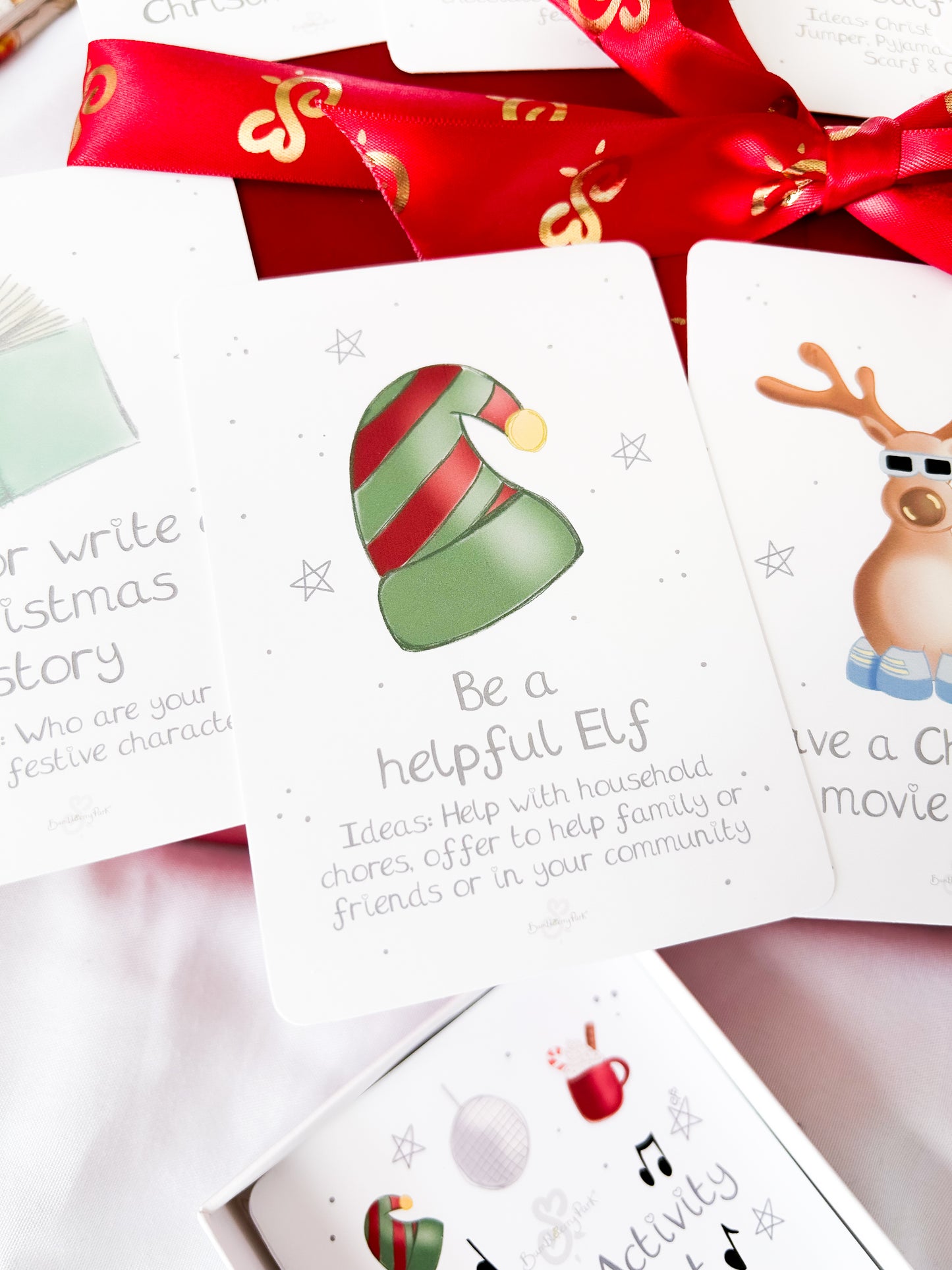 children's Christmas activity card say to be a helpful elf