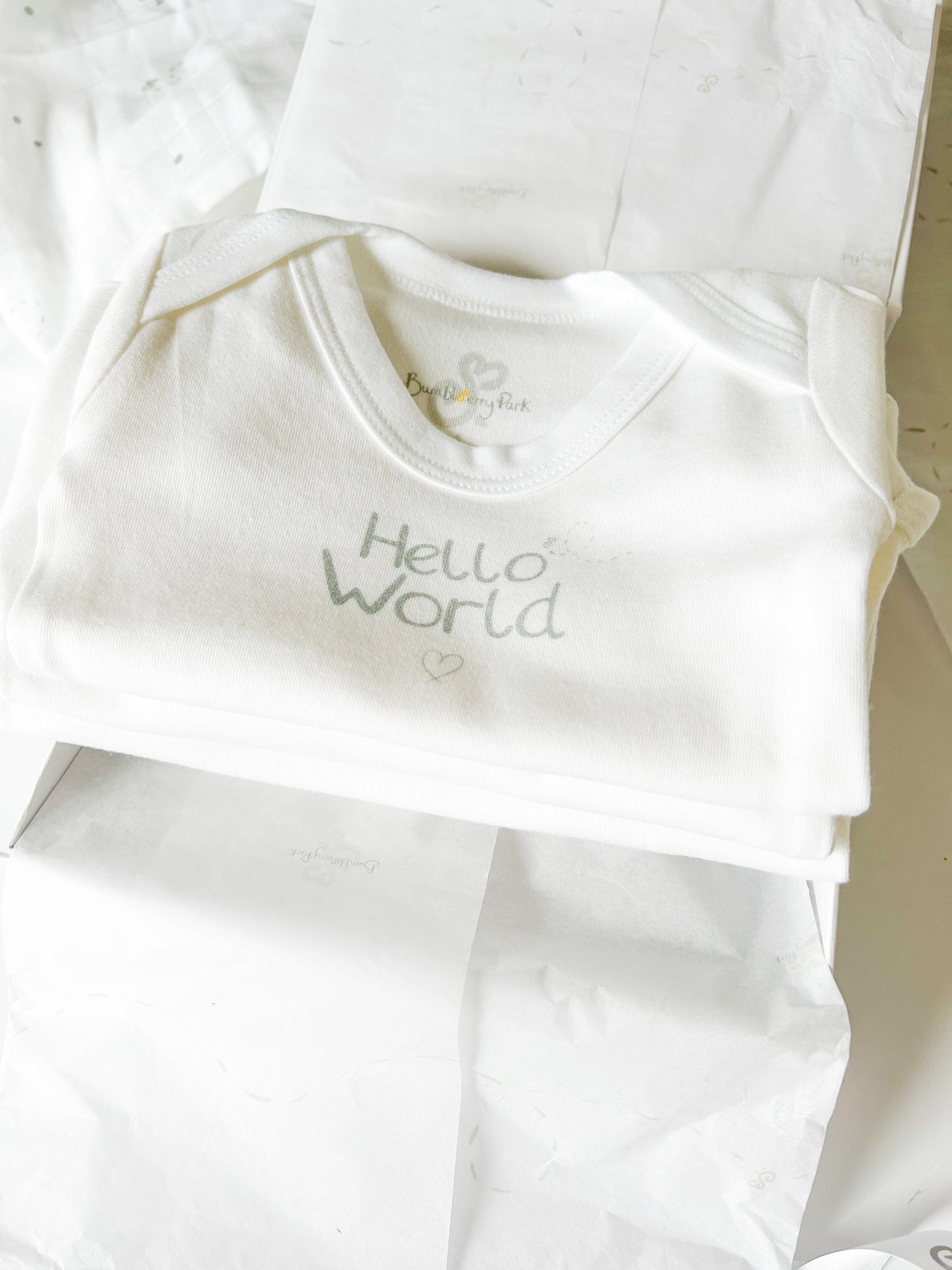 set of three baby vests in a white luxury gift box