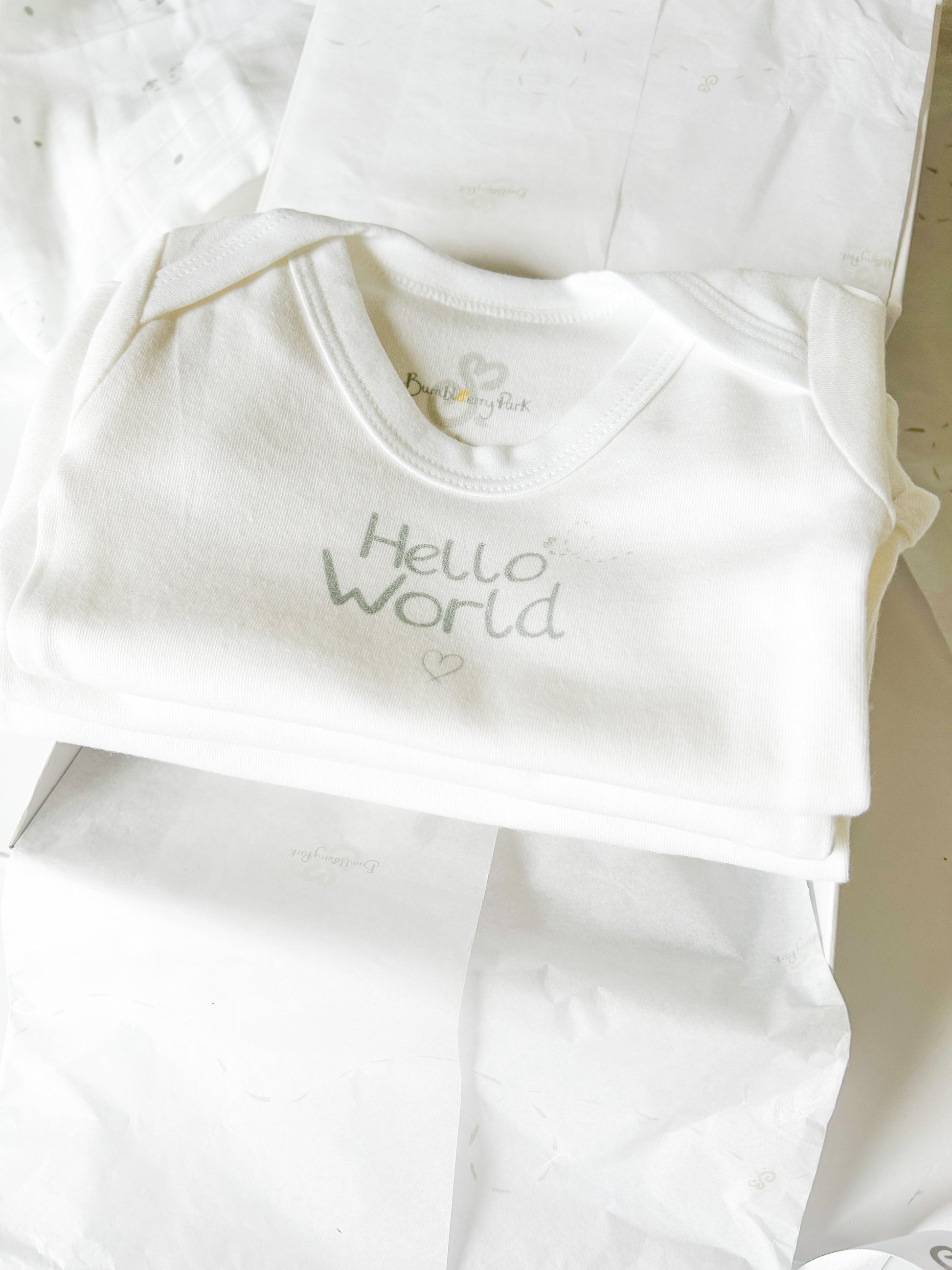 set of three baby vests in a white luxury gift box