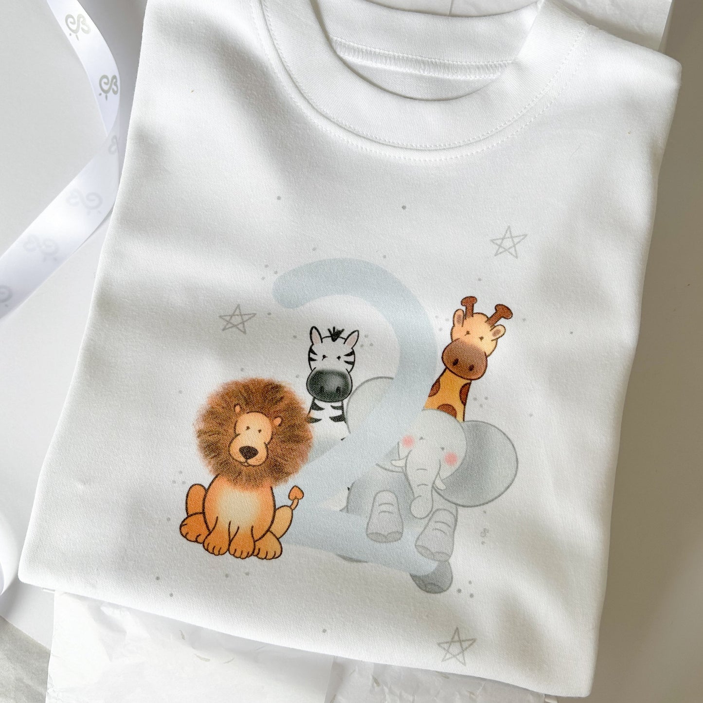 2nd birthday party t-shirt for boy girl with safari animal design with silver star detail in neutral colours