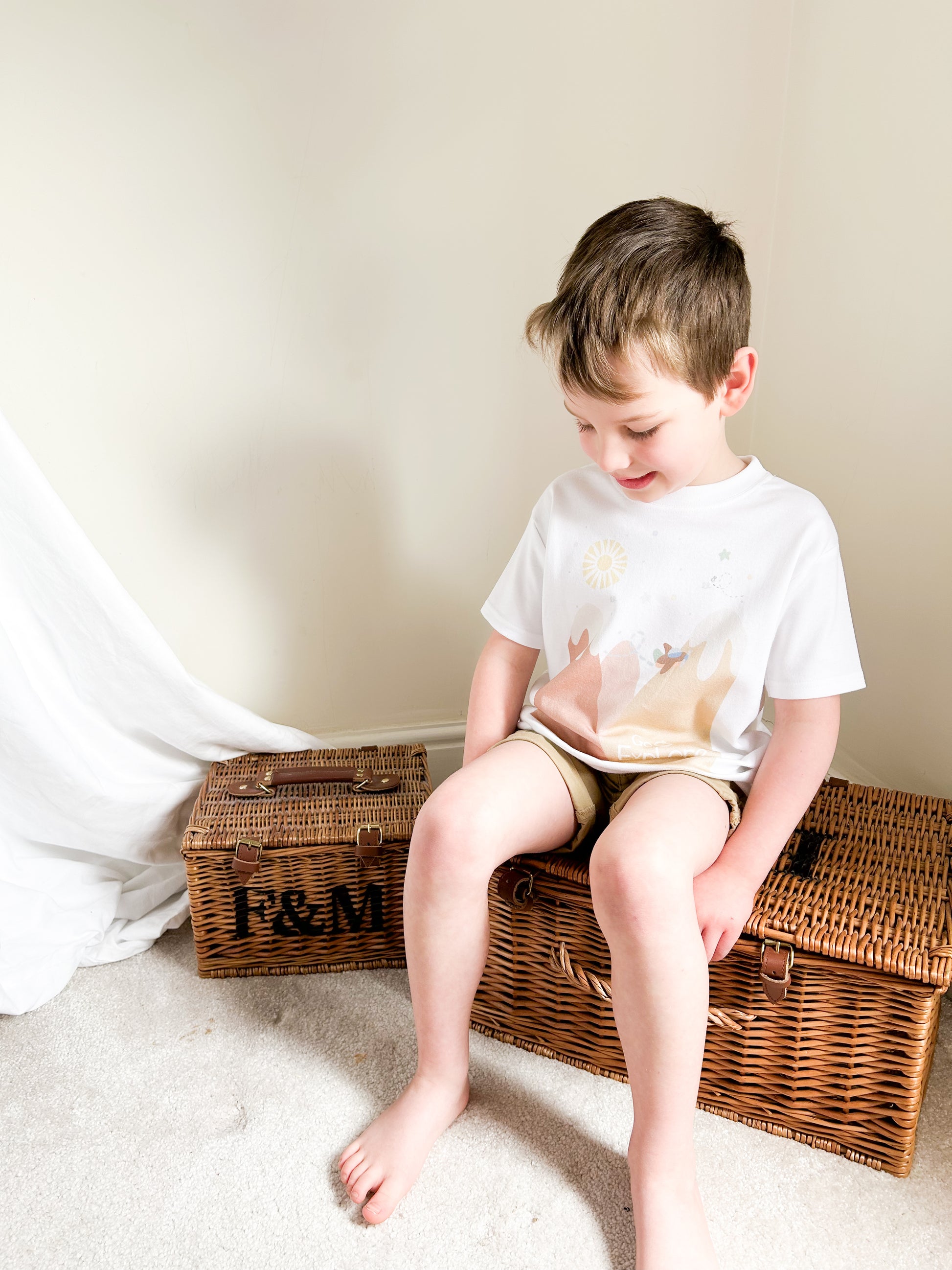 boy wearing a neutral mountains great outdoors little explorer t-shirt 