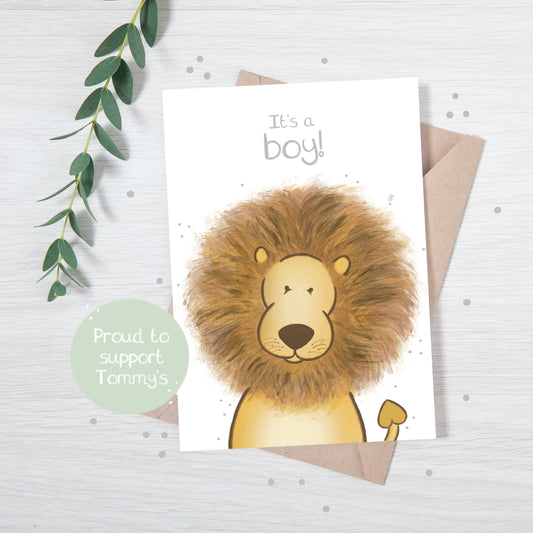 Handmade luxury new baby christening greetings card with a safari theme baby elephant popping up from the bottom with the title &quote "it's a boy" on a white background, with a kraft envelope