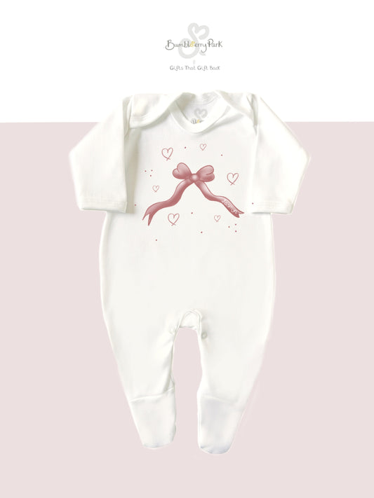 personalised girl's babygrow with pink bow design