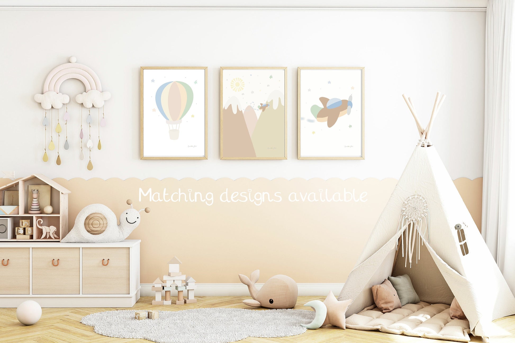 go explore set of 3 adventure art print and baby name print and initial print in neutral tones in a light wood frame in a baby's nursery with hot air balloon, rainbow and aeroplane travel theme
