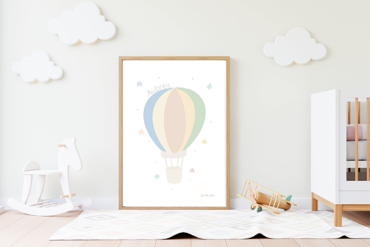 hot air balloon nursery print in neutral colours in a nursery setting