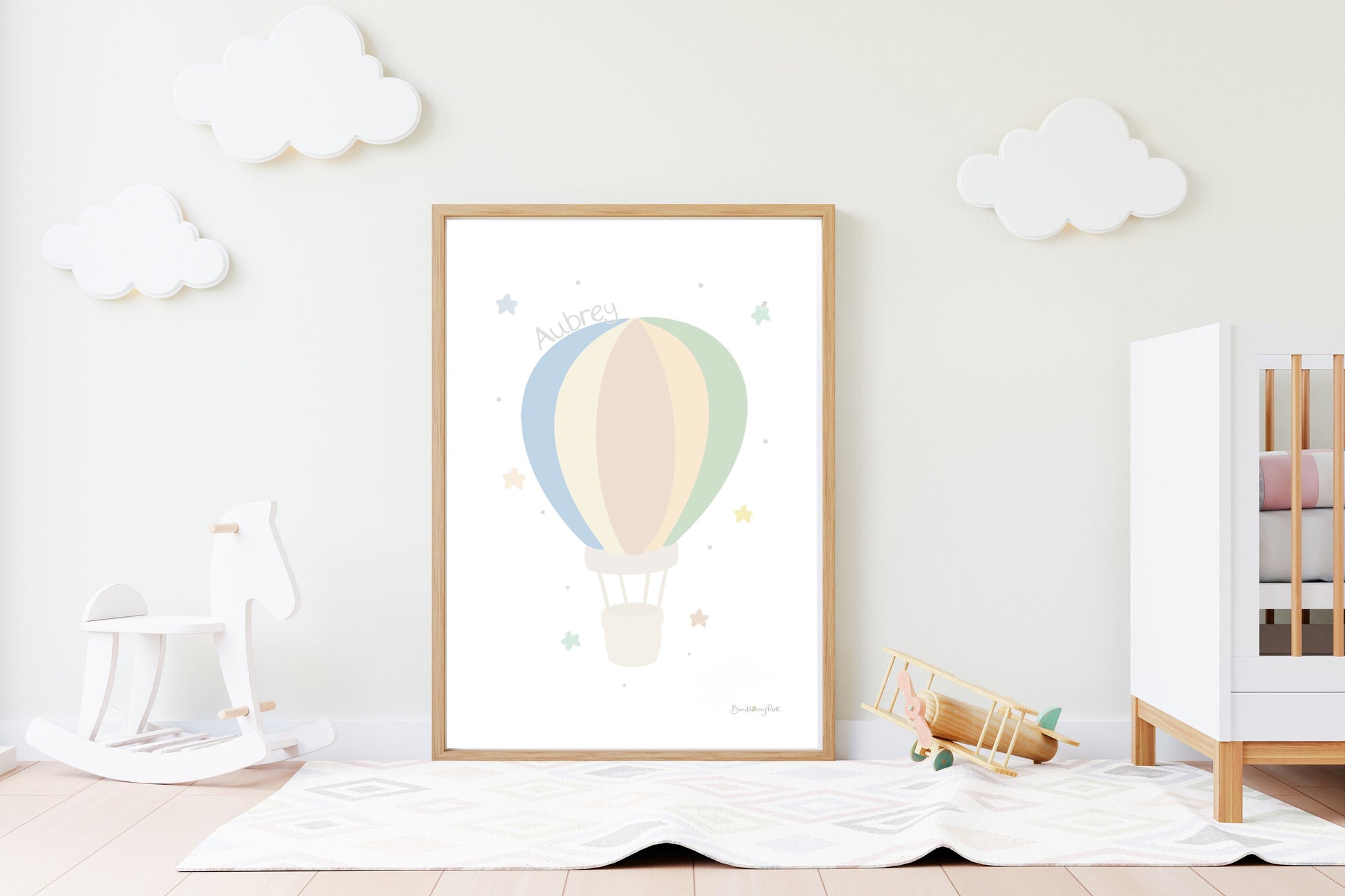 hot air balloon nursery print in neutral colours in a nursery setting
