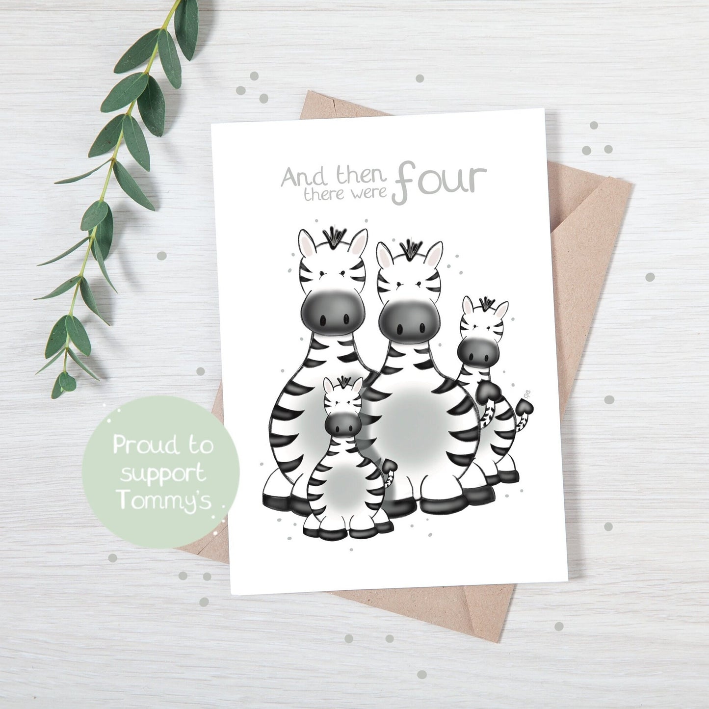 Handmade luxury new baby shower greetings card with a safari theme family of zebras with the title &quote "and then there were 4" on a white background, with a kraft envelope