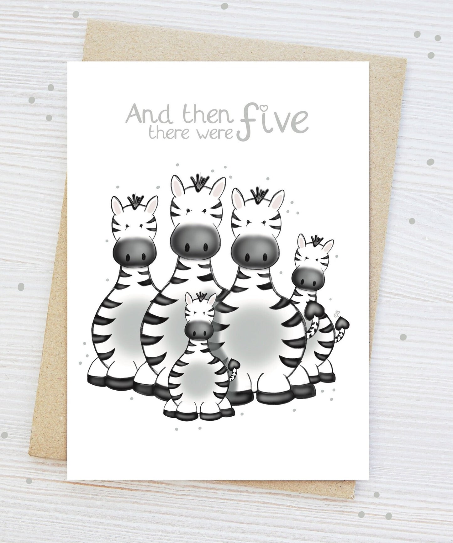 Handmade luxury new baby shower greetings card with a safari theme family of zebras with the title &quote "and then there were 5" family of 5 on a white background, with a kraft envelope
