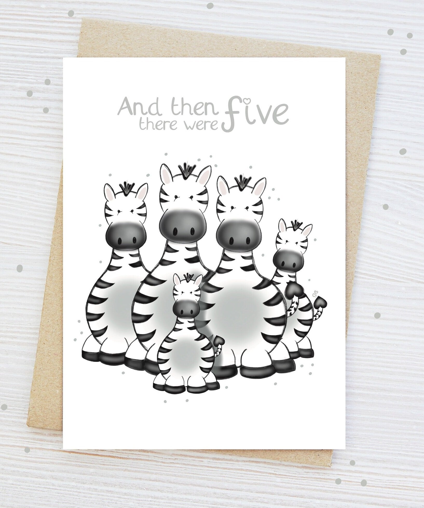Handmade luxury new baby shower greetings card with a safari theme family of zebras with the title &quote "and then there were 5" family of 5 on a white background, with a kraft envelope